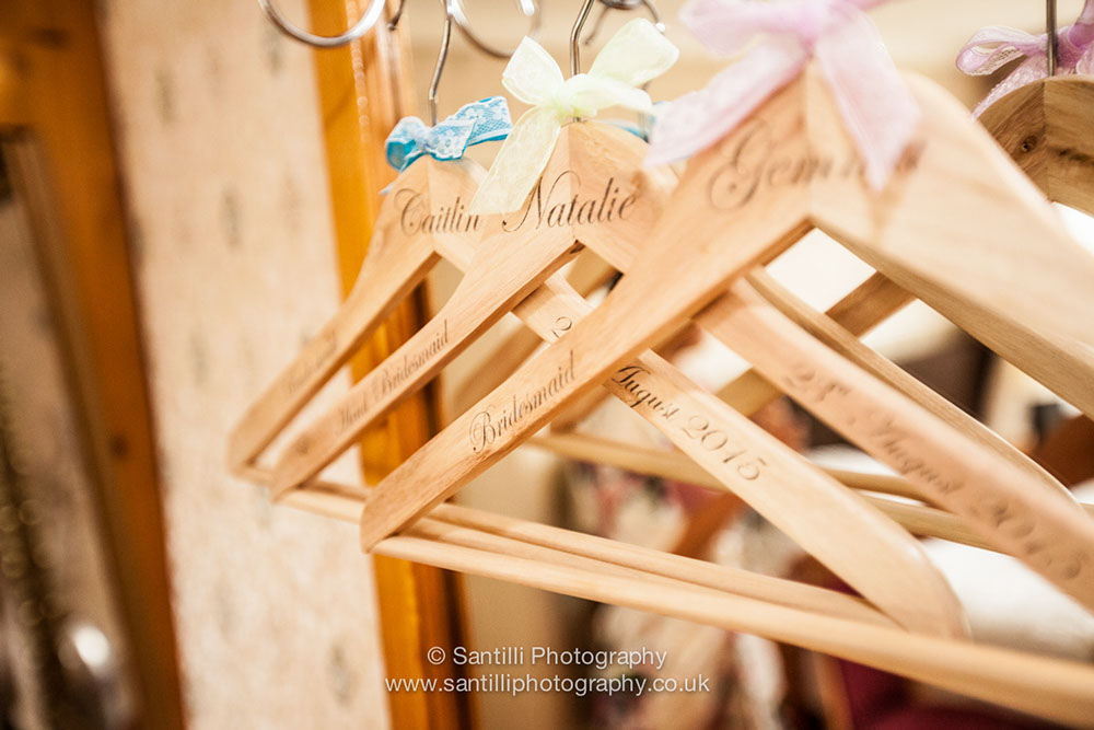 A clothes hanger for each person of the bridal party.