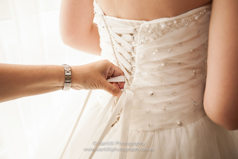 A specail moment when the brides mum help her daughter get ready for the rest of her life.