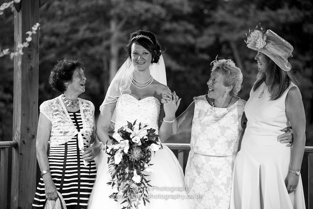 The bride, her mother and two nans posing for a family portrait.