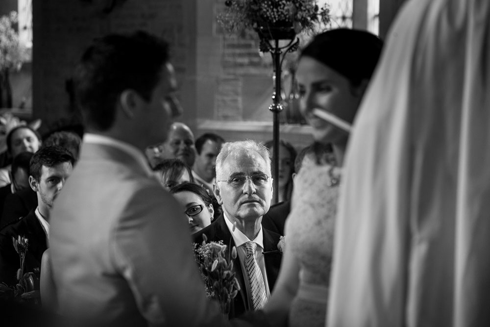 A very proud father of the bride looking on as the wedding couple say their vows. 